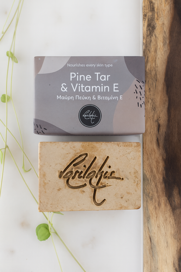 Bar of soap with 'Lerifidis' branding and a box labeled 'Pine Tar & Vitamin E' on a light background.