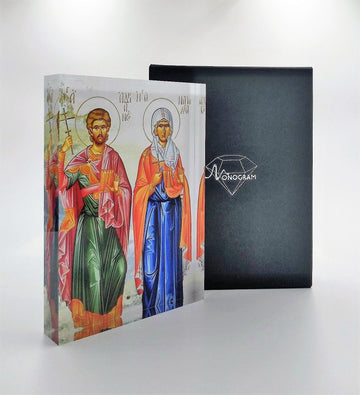 An icon depicting Saint Adrian and Natalia, with a 3D effect, displayed in a protective case.