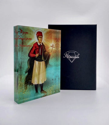 A colorful icon of Saint Zafirios, dressed in traditional Greek attire, holding a cross, with a black box beside it.