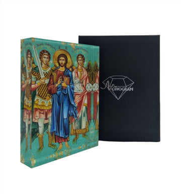 A hand-painted icon depicting Jesus Christ with Archangels Michael and Gabriel, enclosed in a plexiglass case with a black exterior. The icon features vibrant colors and decorative elements.