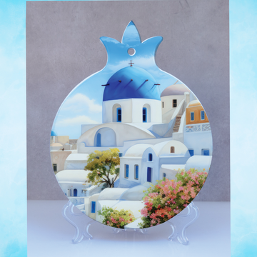 decorative featuring a vibrant and detailed illustration of a Greek village on Santorini with a blue sky, white buildings, and pink flowers