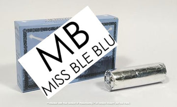 A pack of Miss Blue brand incense charcoal with the brand name 'MΤB' prominently displayed on top. The packaging is primarily blue with a silver foil wrapping around the charcoal tablets.