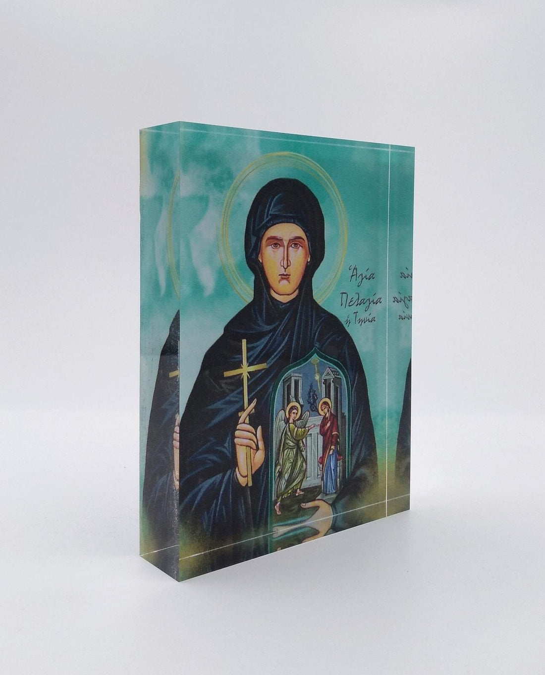 A handcrafted icon of Saint Pelagia made with a 3D effect, presented in a box with the Monogram Atelier logo.