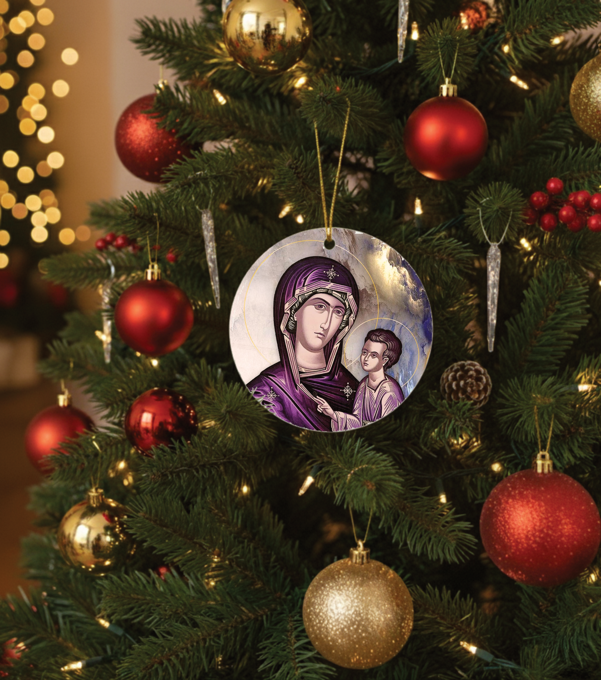 Decorative Christmas ornament with a religious design on a Christmas tree.