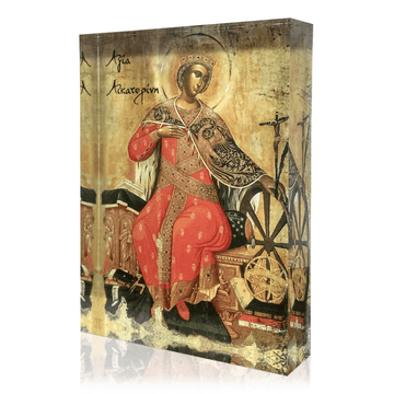 A icon featuring Saint Catherine with a martyr's cross and a wheel, seated on a throne, dressed in a red and gold robe, with a dark background.