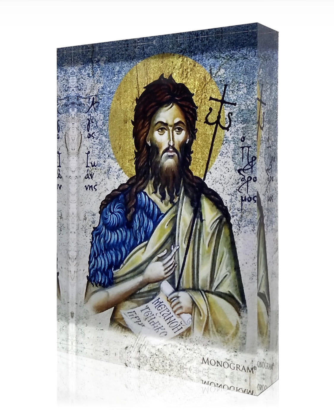 A handcrafted icon of Saint John the baptist with a 3D effect, featuring a gold halo and holding a book and a staff. The background is blue with decorative elements.