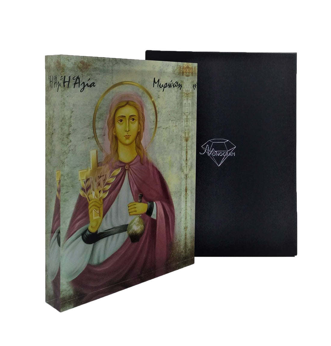 A handcrafted icon of Saint Myropi, featuring the subject in traditional Orthodox garb, with a 3D effect, set behind plexiglass. The icon is accompanied by a black box with a gold Monogram Atelier logo.