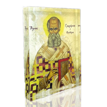 An icon of Saint Gregory the Theologian, featuring a man with a beard and mustache, wearing a white and gold robe, holding a book and a cross, with a 3D effect.