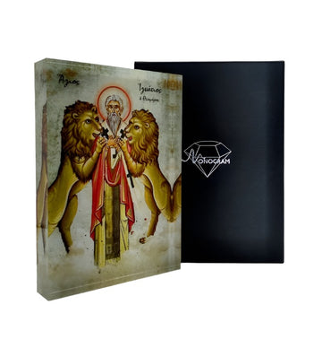 Icon of Saint Ignatius with a 3D effect, surrounded by lions, in a vibrant and detailed portrayal, with a black background and the Monogram Atelier logo.