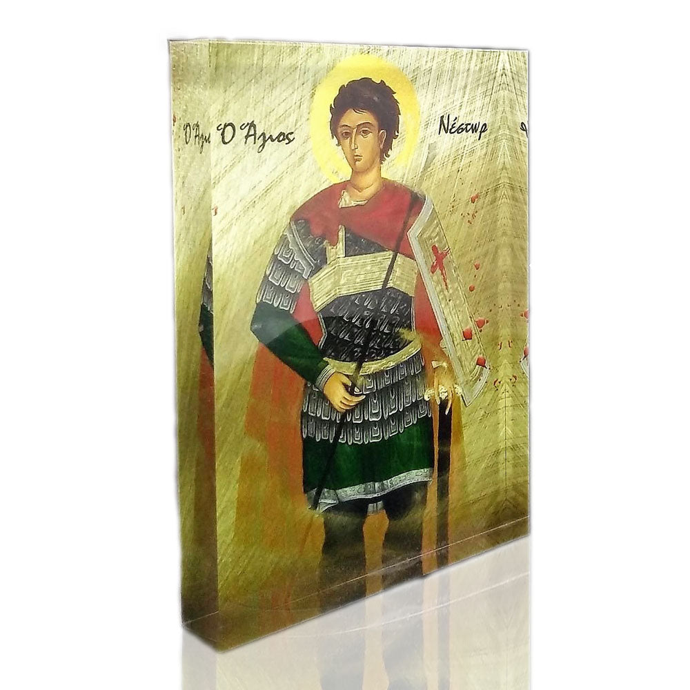 A handcrafted icon of Saint Nestor, featuring a figure with a halo, dressed in traditional attire, holding a book, and standing against a golden background.