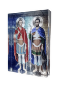 A plexiglass icon featuring two saints, Theodoros, with a blue and red robe and another in green and blue, standing side by side against a blue background.