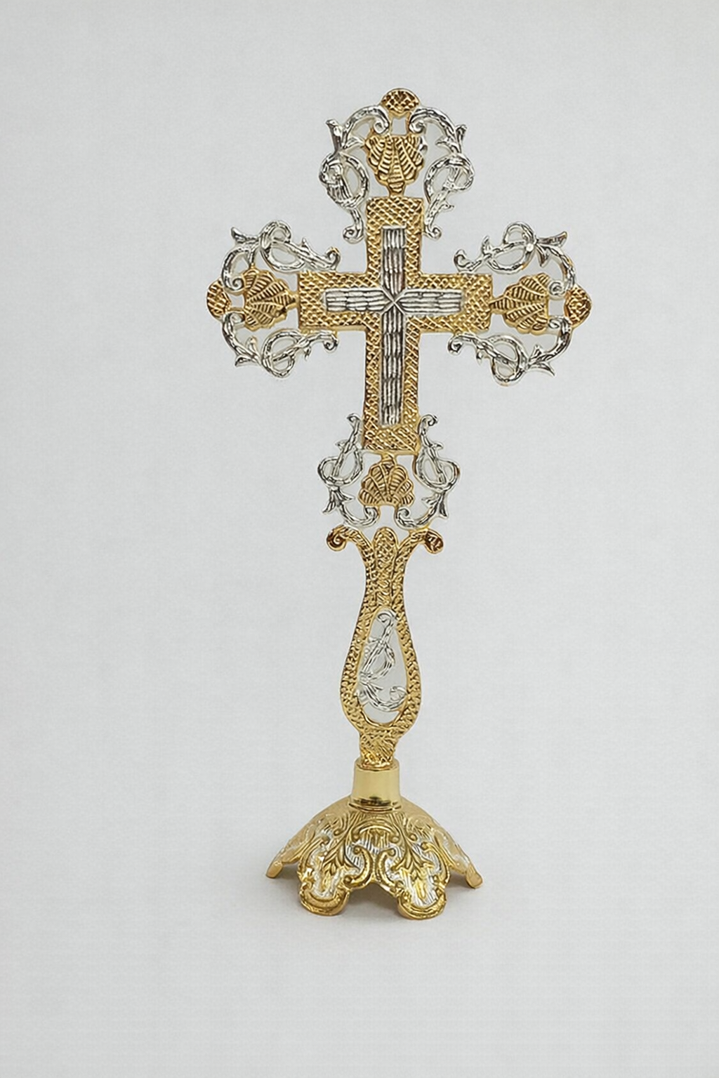 Orthodox brass standing cross with gold and silver two-tone finish. Decorative Greek Orthodox altar cross for prayer corner or home display.