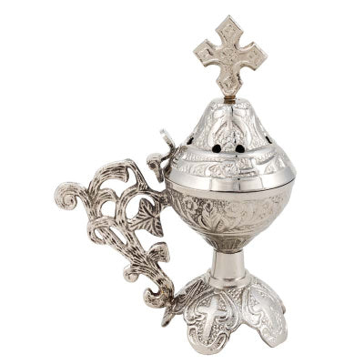 Decorative gold incense burner with cross on a white background