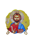 Small round Christ Pantocrator icon plate displayed on metal stand.