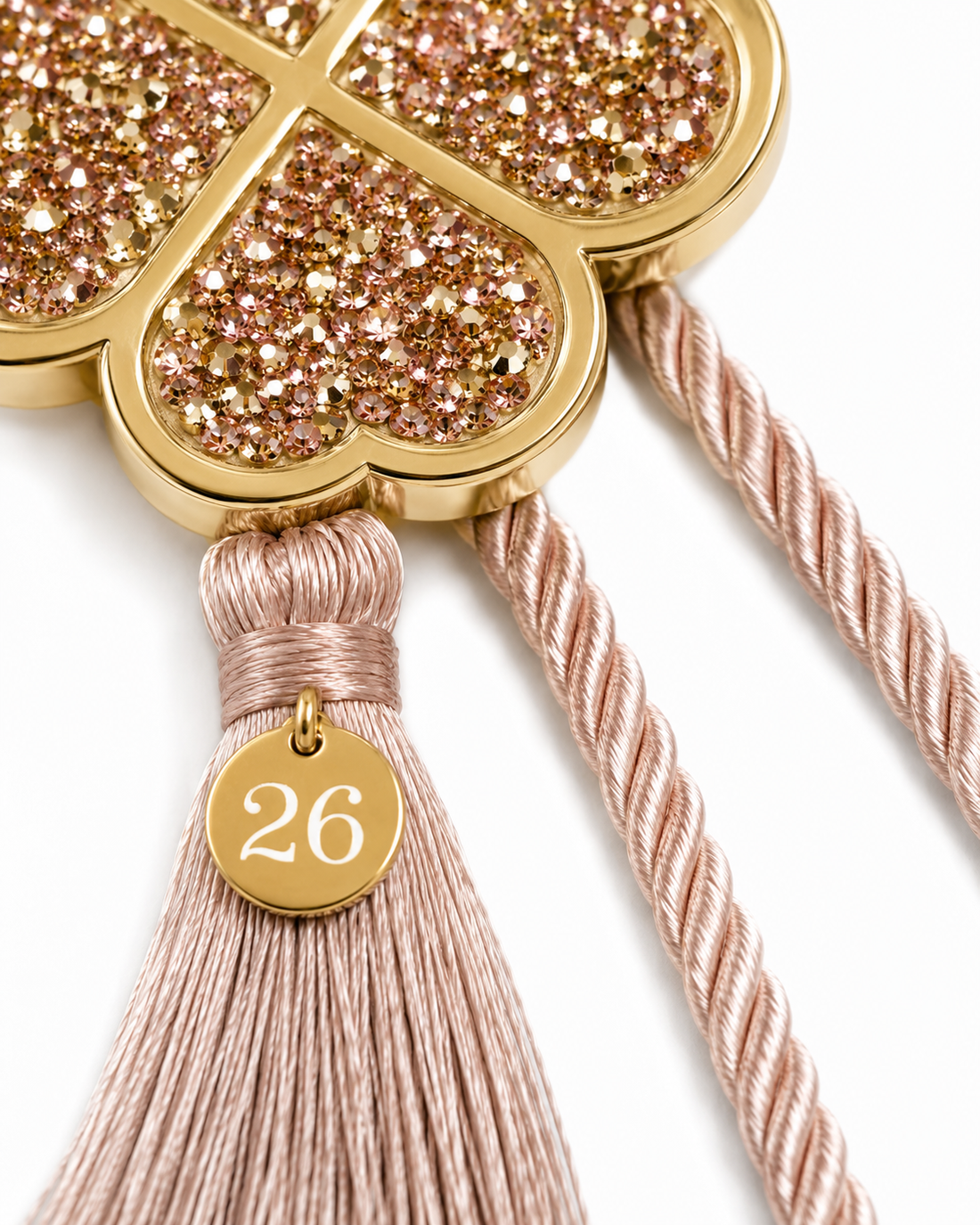 Four leaf clover lucky charm gouri with gold blue rhinestones, mocha cord, tassel, small 26 tag and gift box with gold ribbon.