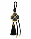 Four leaf clover lucky charm gouri with gold blue rhinestones, black cord, tassel and small tag.