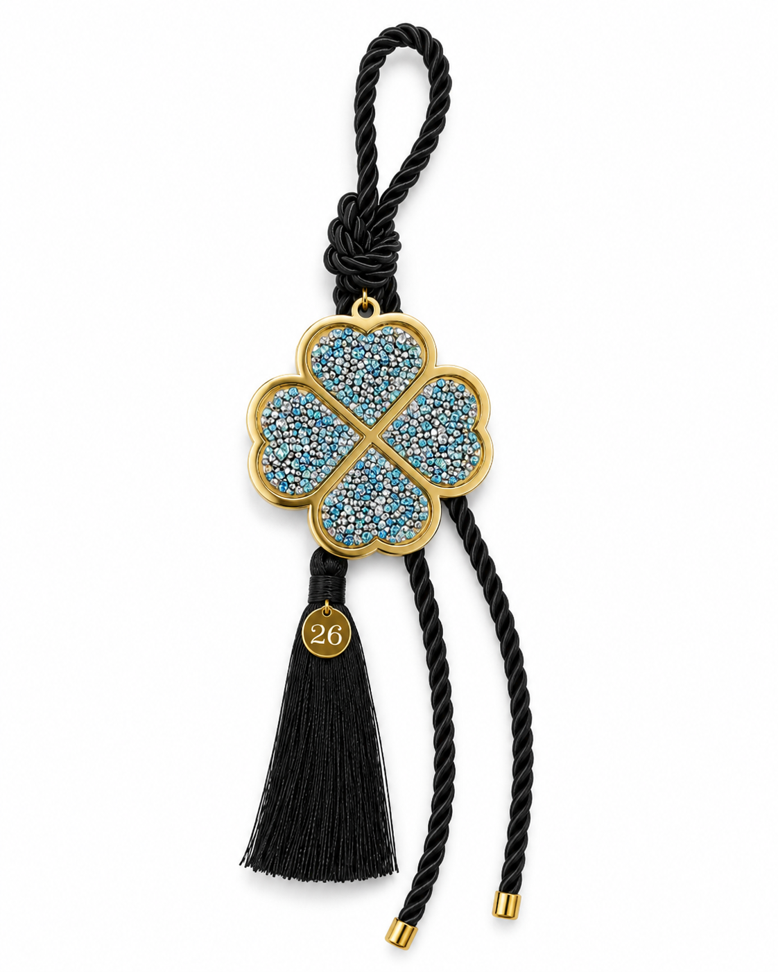 Four leaf clover lucky charm gouri with gold light blue rhinestones, black cord, tassel and small 26 tag.