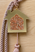Gold acrylic house gouri 2026 rhinestone lucky charm made in Greece