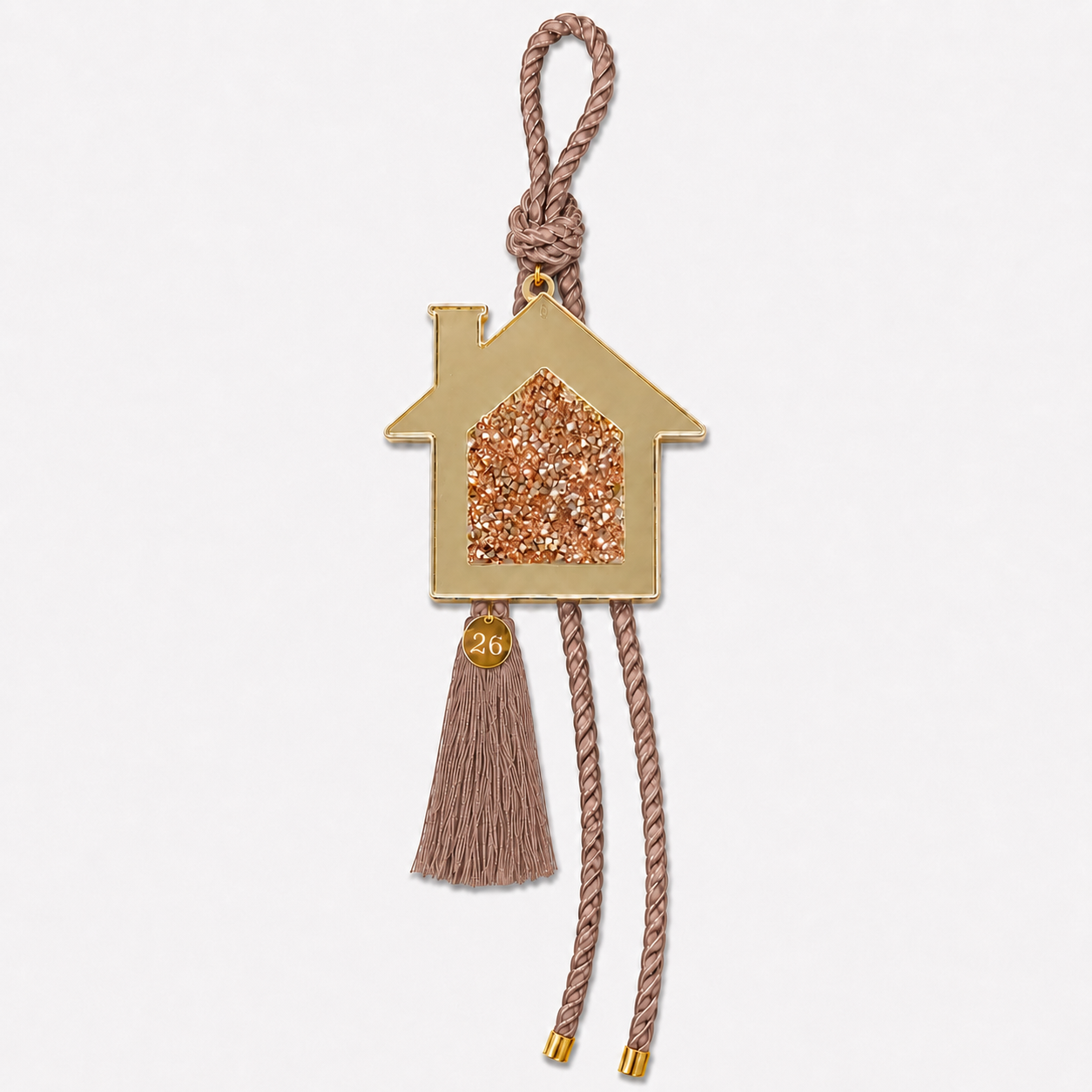 Gold acrylic house gouri lucky charm with gold and pink rhinestones, mocha cord and tassel