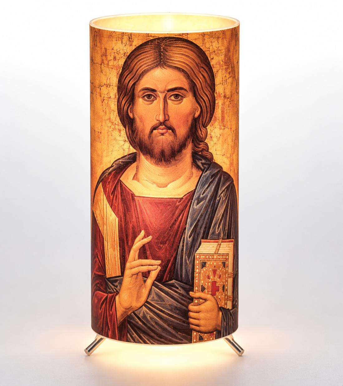 Illuminated Jesus Christ Orthodox icon lamp styled with festive Christmas greenery, candles and pomegranates