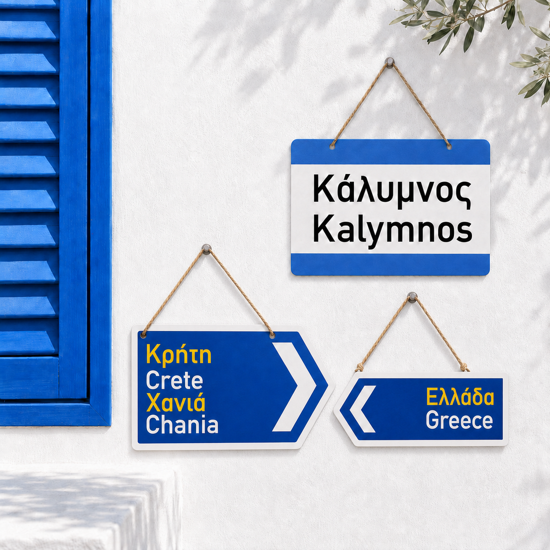Original Greek metal street signs by Miss Ble Blu showing three styles: rectangular Kalymnos sign, double arrow Crete Chania sign, and single arrow Greece sign