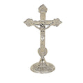 An Orthodox brass cross with a gold or silver finish, showcasing a contemporary design with intricate details.