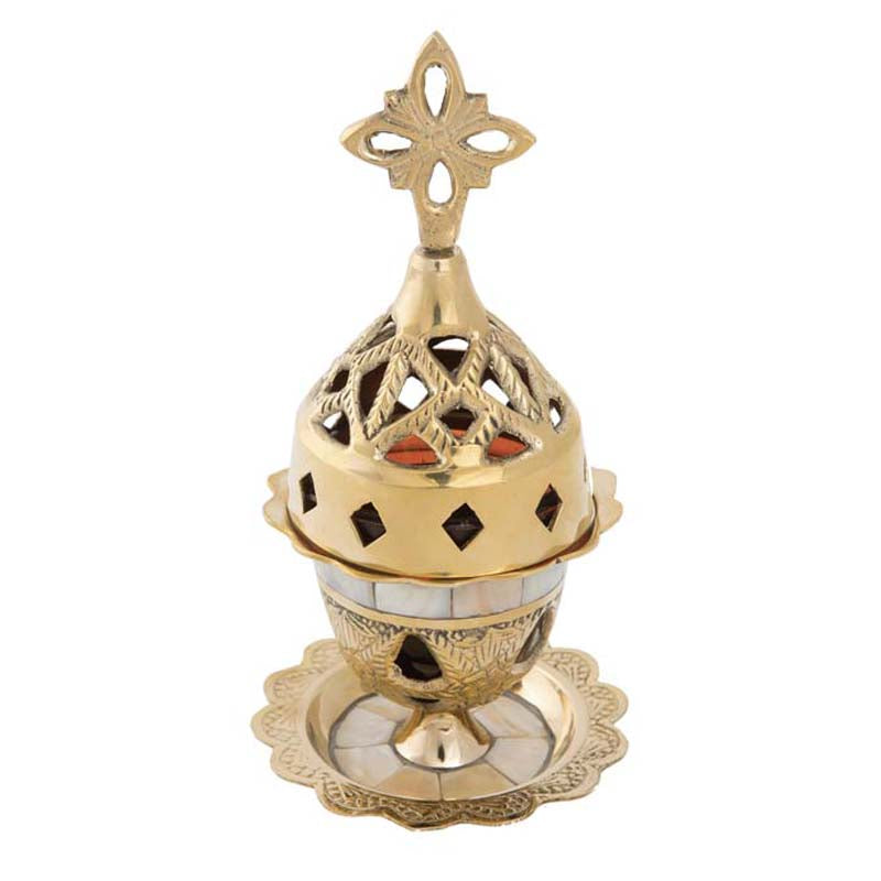 Decorative gold incense burner with intricate designs on a white background.