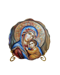 Mini Panagia icon plate with vibrant artwork on gold stand.