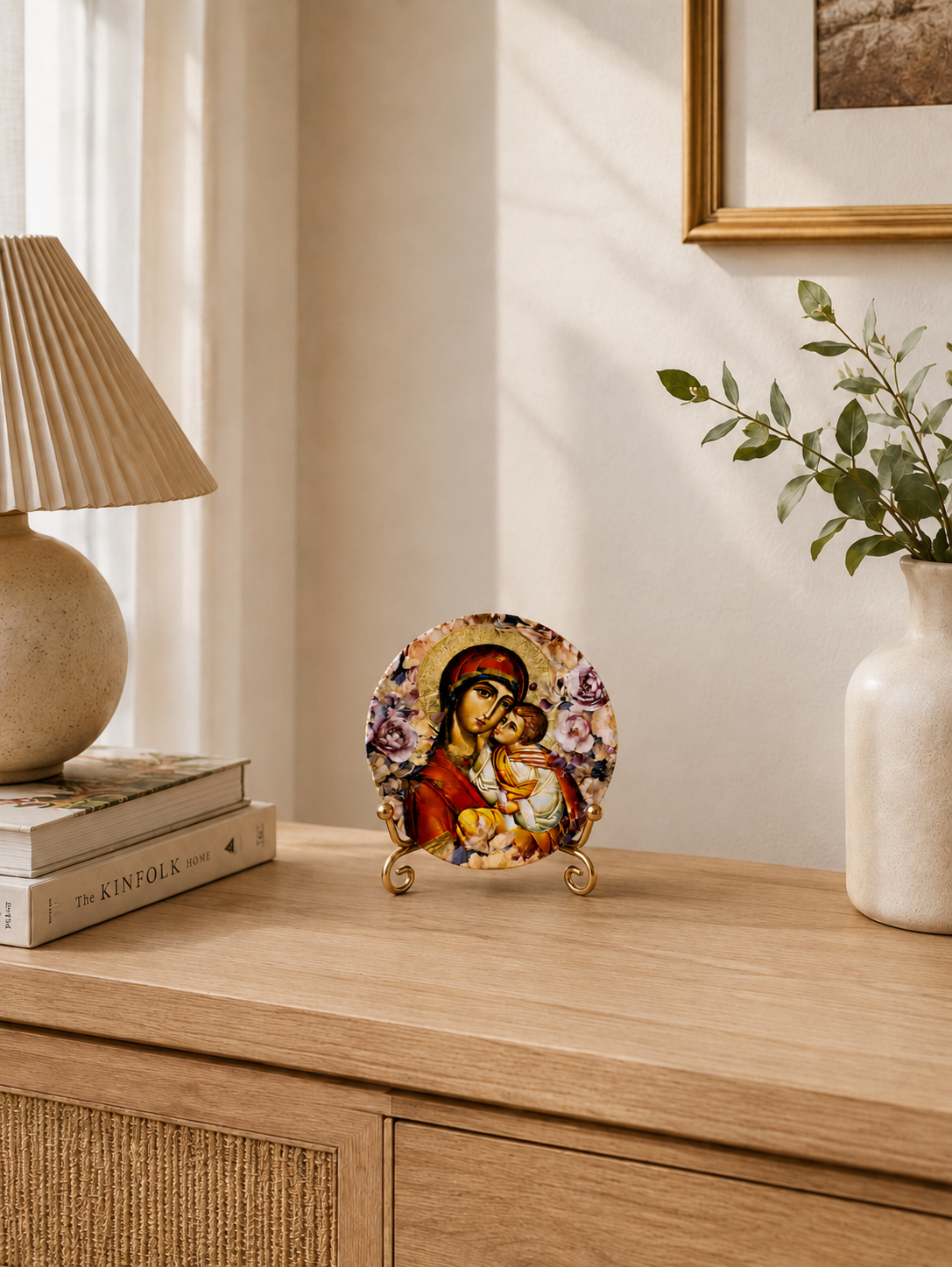 Panayia and Christ Child ceramic Orthodox icon plate on a gold display stand, styled in a warm Greek Orthodox home setting
