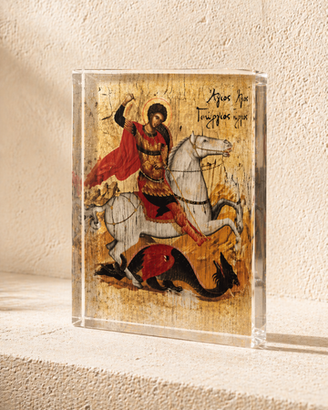 Orthodox icon of Saint George displayed in a styled home setting. Handmade Greek plexiglass icon with a striking 3D effect.