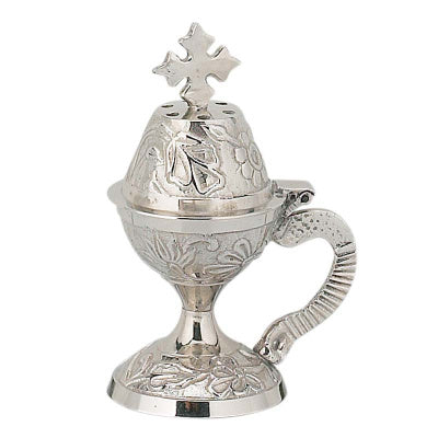 Gold incense burner with cross on a white background