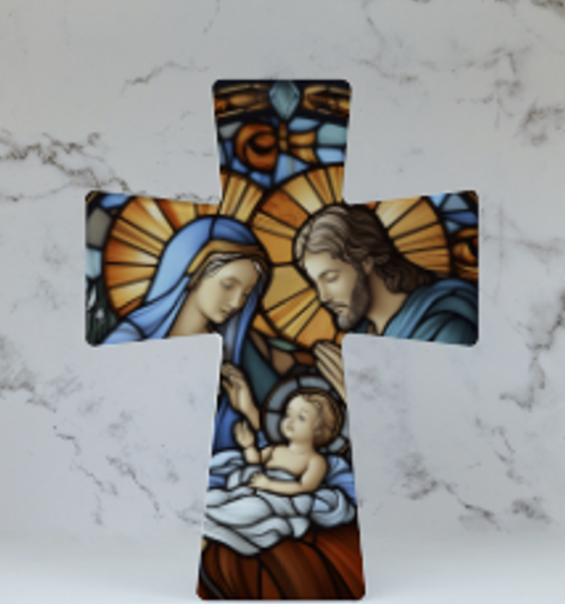 A ceramic cross with a stained glass effect depiction of The Holy Family, featuring figures in blue robes with gold accents on a marble background.