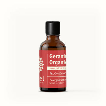 A bottle of Geranium Organic Essential Oil with a red label on a white background.