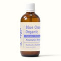 A bottle of Organic Greek Blue Camomile Hydrolat with a white label on it.