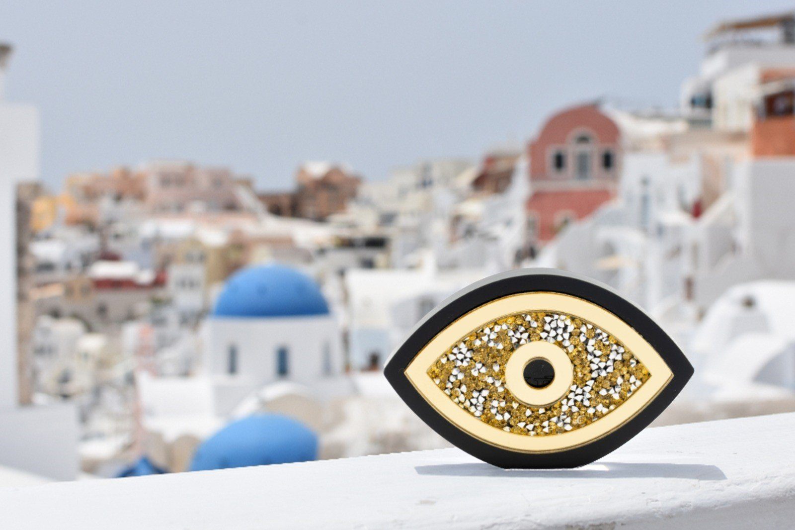 Evil Eye home décor piece decorated with rhinestones.