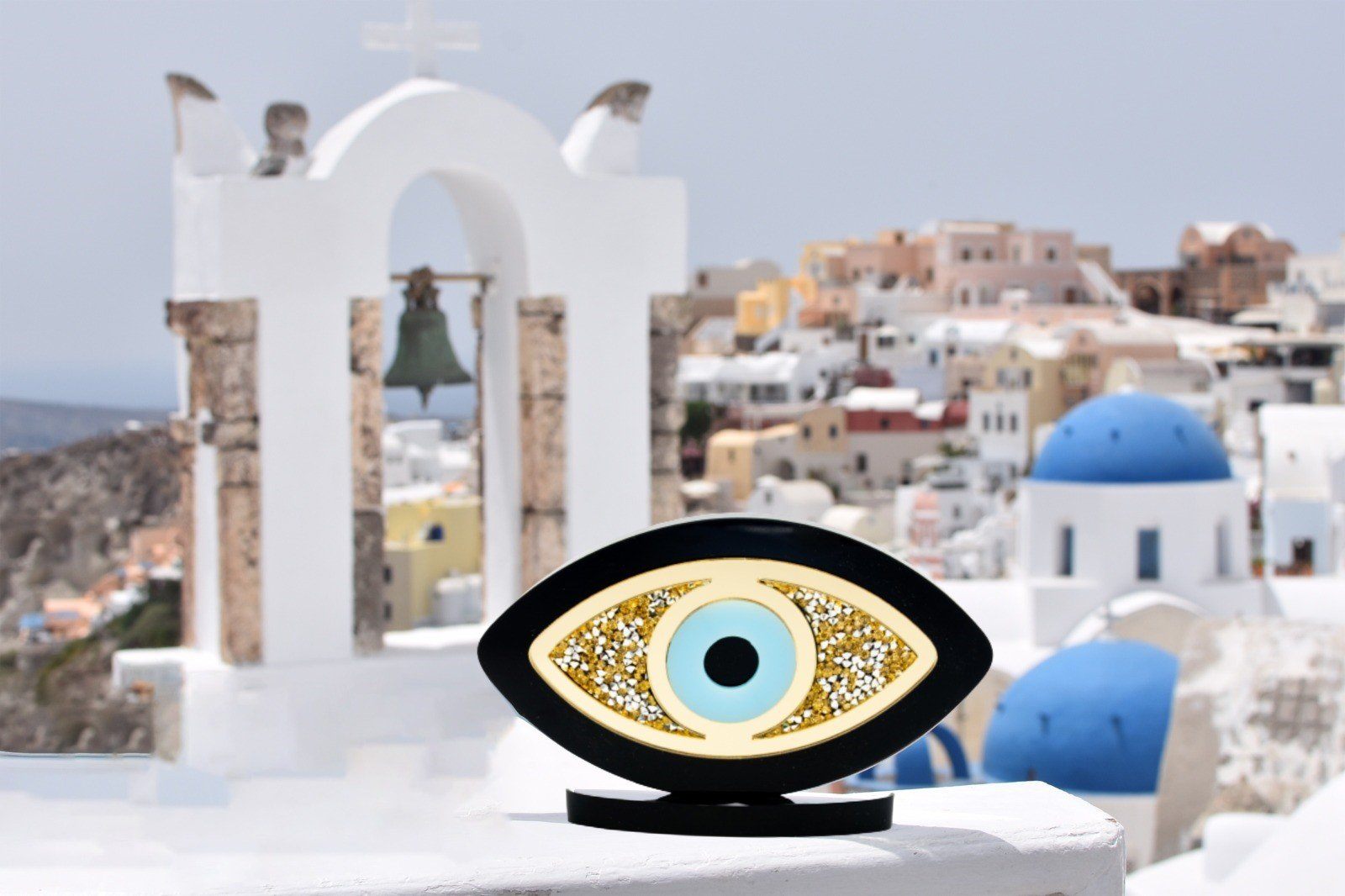 Acrylic plexiglass Evil Eye home décor piece decorated with rhinestones.