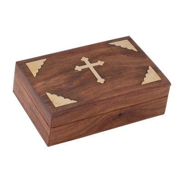 A rectangular walnut wood keepsake box with brass accents and a cross design on the lid.