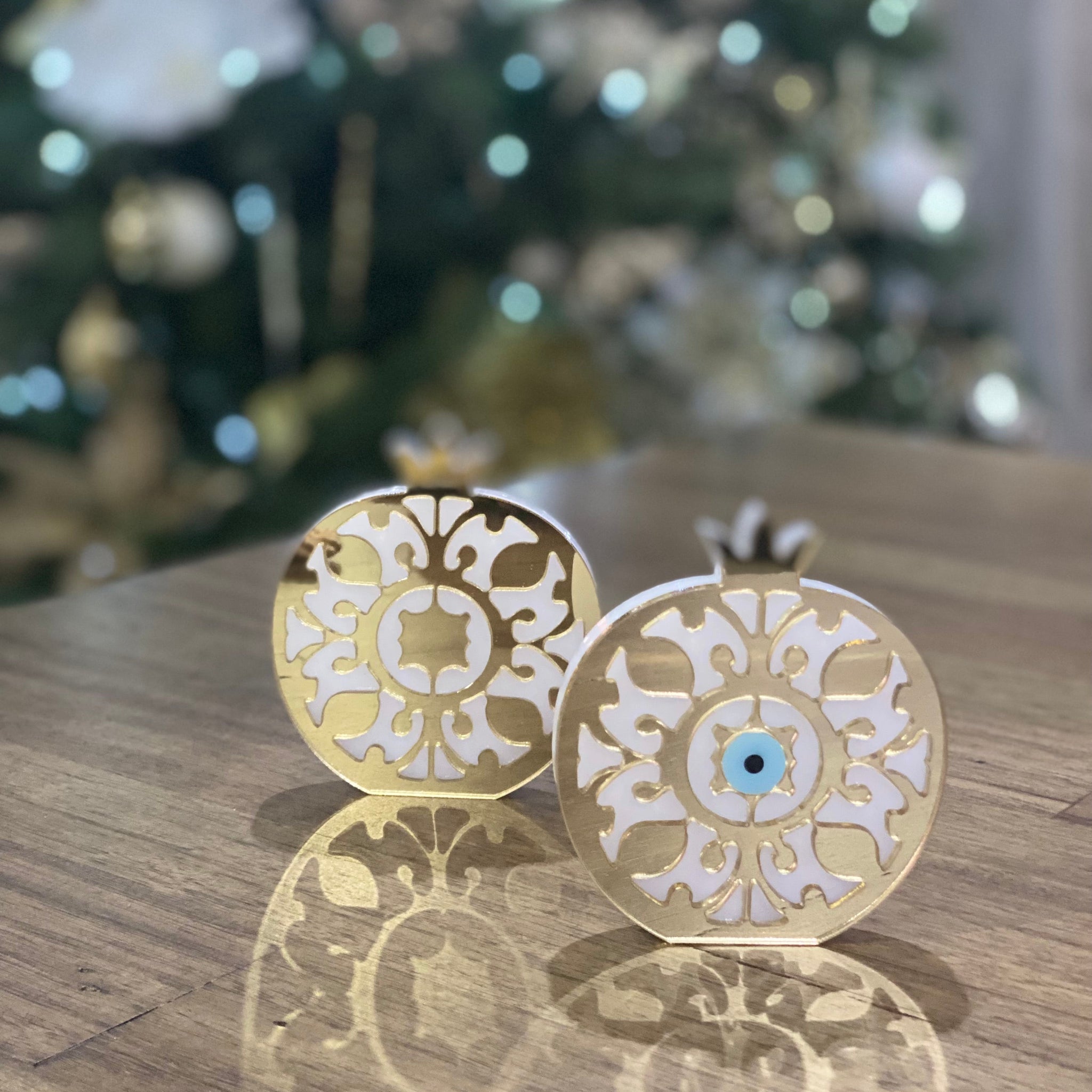 Gold acrylic plexiglass pomegranate with optional mati Greek evil eye detail.