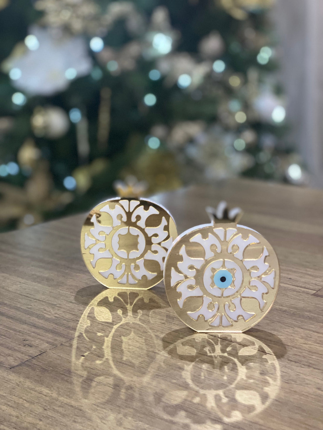 Gold acrylic plexiglass pomegranate with optional mati Greek evil eye detail.