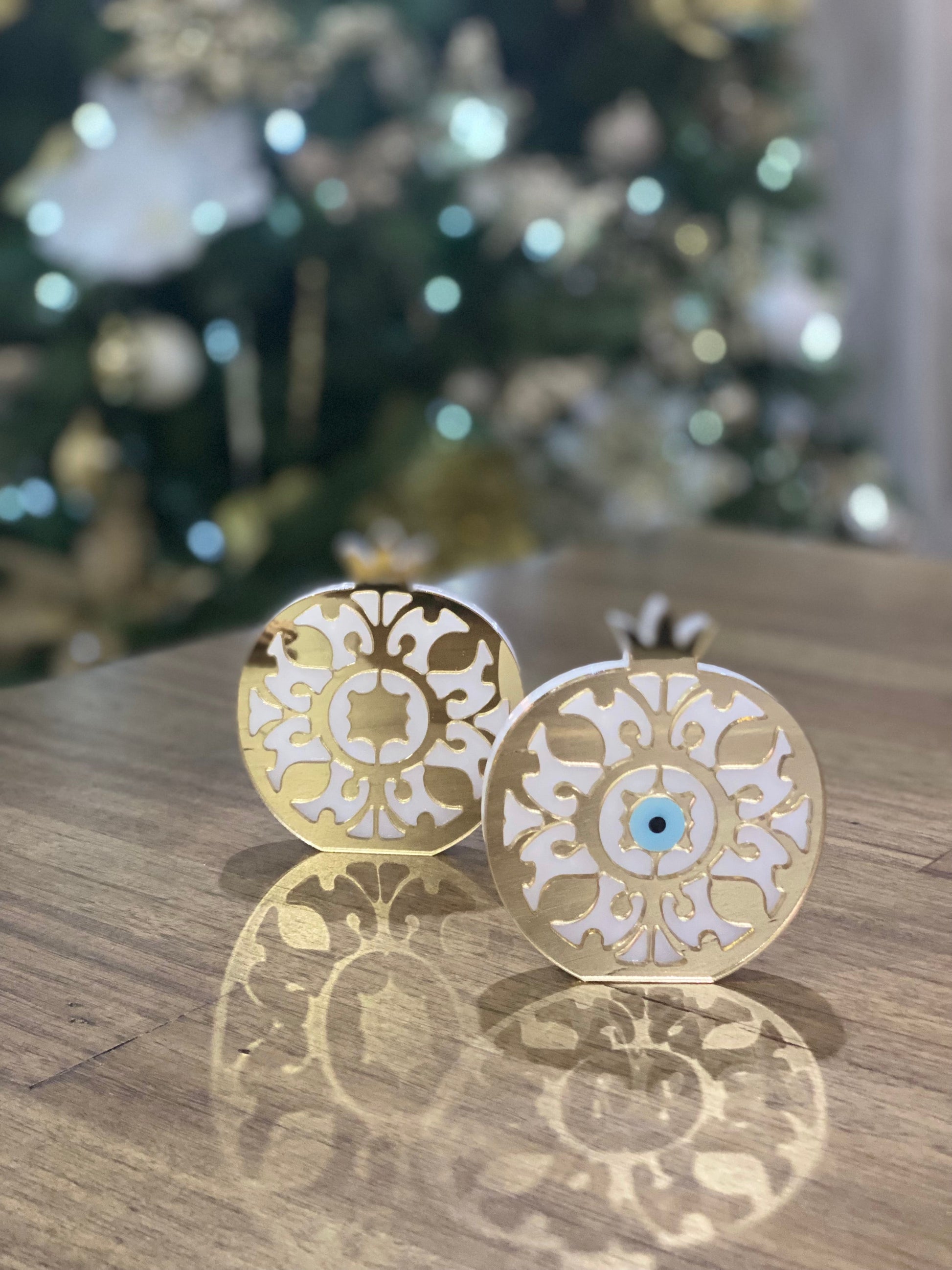 Gold acrylic plexiglass pomegranate with optional mati Greek evil eye detail.
