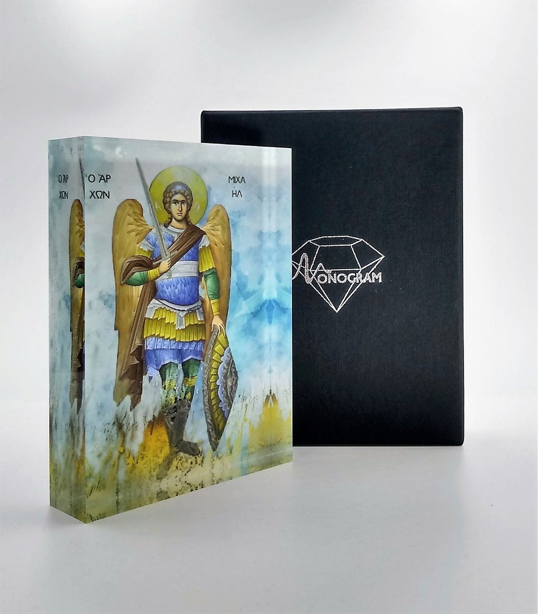 Orthodox plexiglass icon of Archangel Michael the warrior, shown full-body with sword and shield. Handmade Greek icon displayed with Monogram Atelier gift box.
