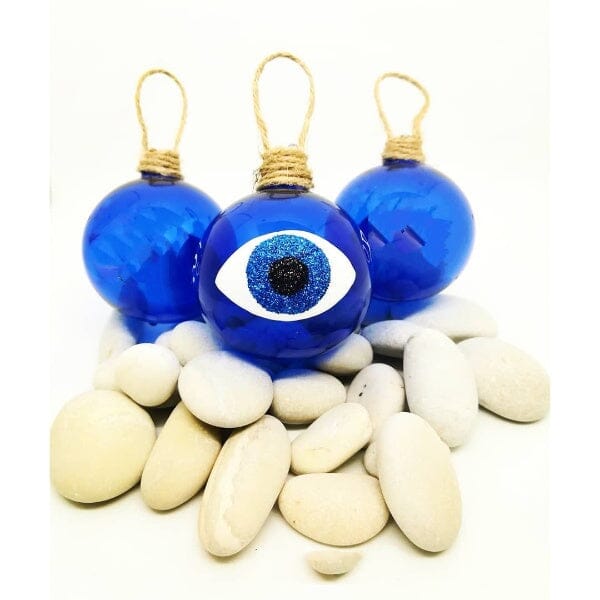 Hand blown glass baubles in blue with a mati design, or an evil eye.  
